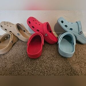 3 pair of crocs. Tan, Red, Light Blue. 8(M), 10(W).